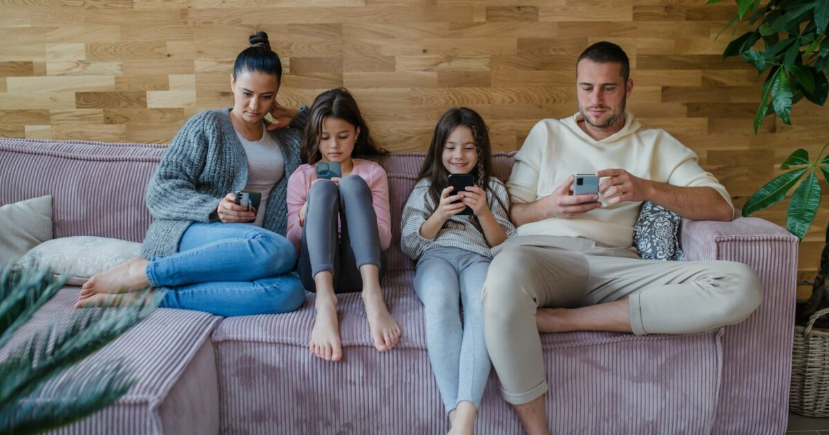family playing mobile games