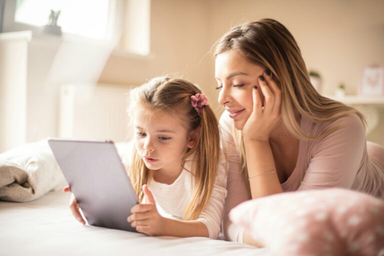 mom and daughter playing mobile games